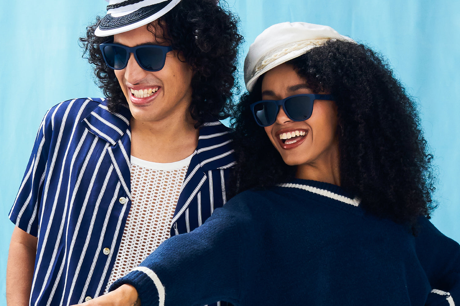 Man And Woman Wearing Black Sunglasses With Blue Lenses