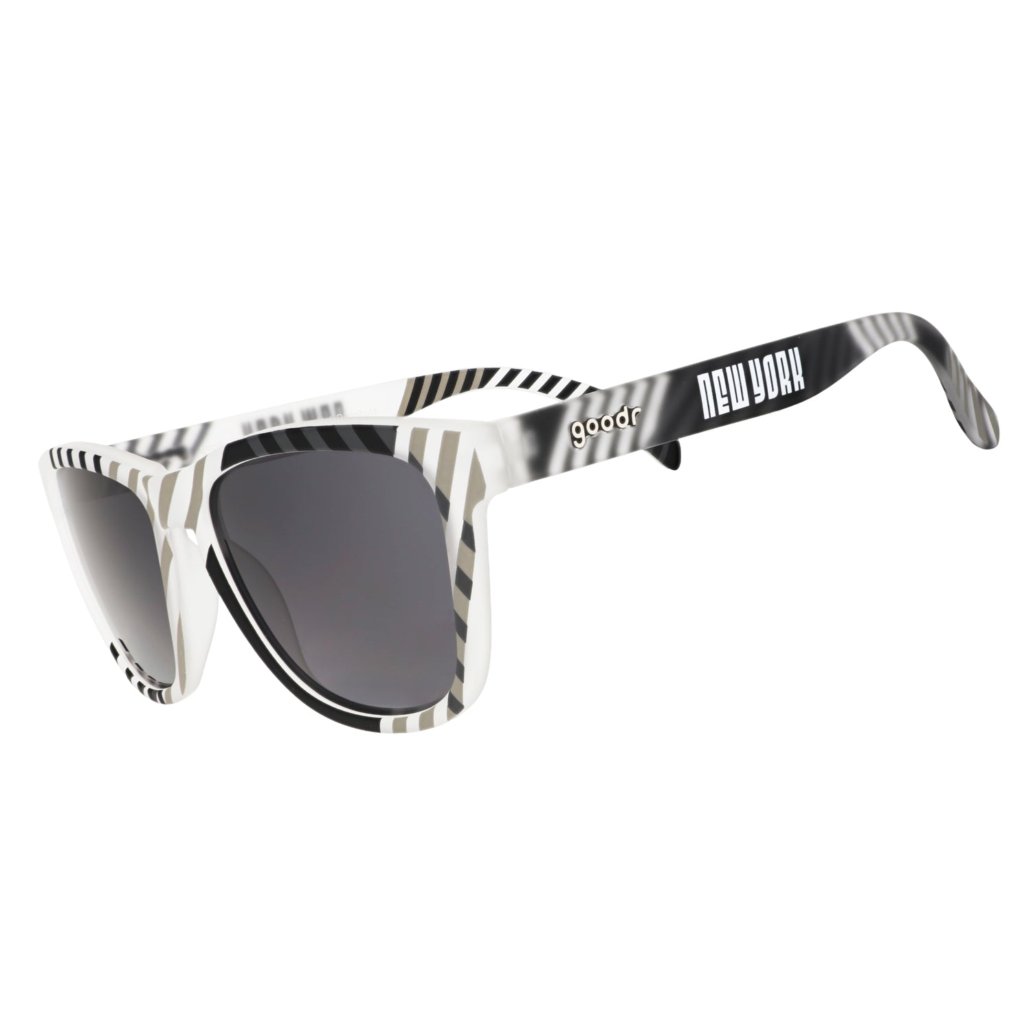 Three-quarter angle view of gray and black sunglasses featuring a geometric print and New York logo.