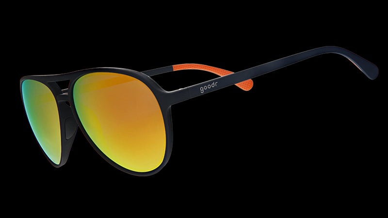 Three-quarter angle view of black aviator sunglasses with amber lenses.