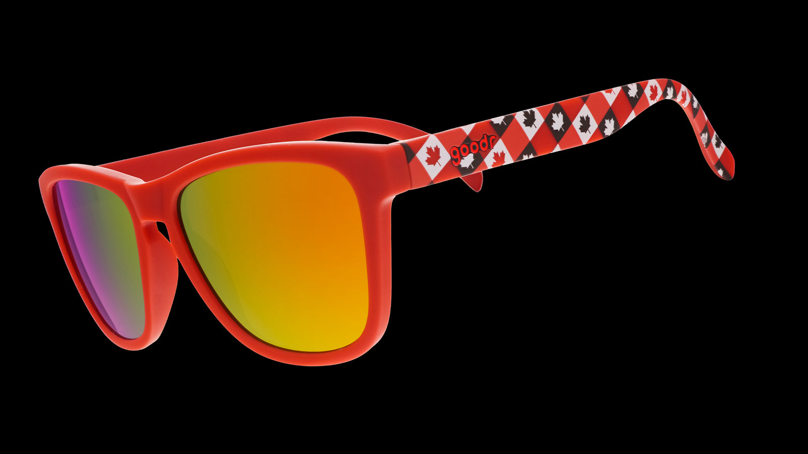 Three-quarter angle view of red Canada sunglasses with maple leaf-patterned frames and burnt orange reflective lenses.