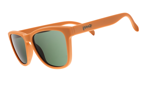 Three-quarter angle view of classic brown sunglasses with green non-reflective lenses.
