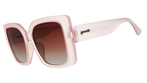 Three-quarter angle view of stylish oversized square taupe sunglasses with brown gradient lenses.
