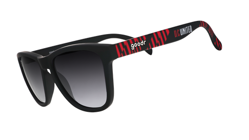Three-quarter angle view of DC United Major League Soccer sunglasses with black and red frames and black lenses.
