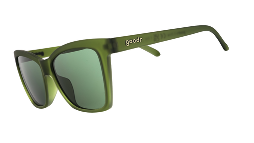 Three-quarter angle view of translucent dark green angular sunglasses with green non-reflective lenses.