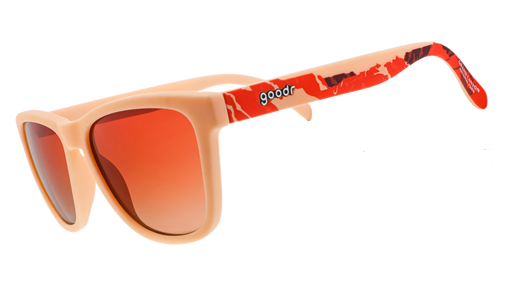 Grand Canyon National Park sunglasses, featuring square frames, orange lenses, and a mountain silhouette design across the temples in shades of orange, brown, and peach.