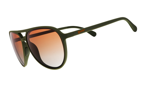 Three-quarter angle view of green aviator sunglasses with amber gradient lenses.
