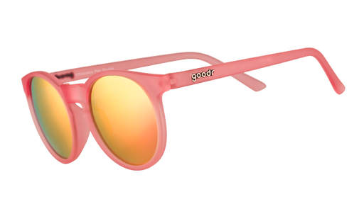 Three-quarter angle view of pink round sunglasses with pink mirrored polarized lenses.