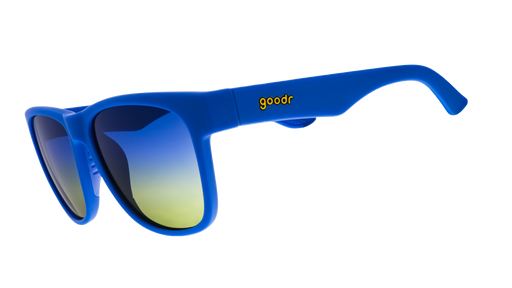 Three-quarter angle view of large blue glasses with blue-yellow ocean gradient lenses.