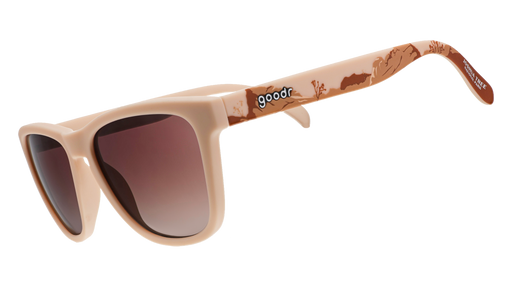 Joshua Tree National Park-themed sunglasses with brown-tinted lenses and a desert landscape design on beige frames, on a white background.