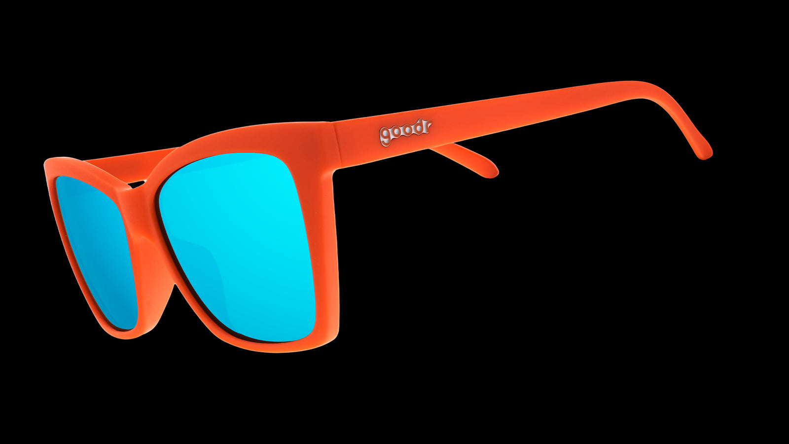 Three-quarter angle view of red angular sunglasses with blue reflective lenses.
