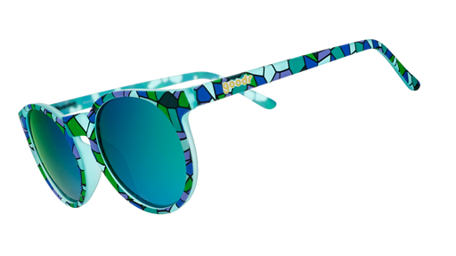 Three-quarter angle view of a pair of teal Circle Gs with a stained glass-inspired design and green reflective lenses.
