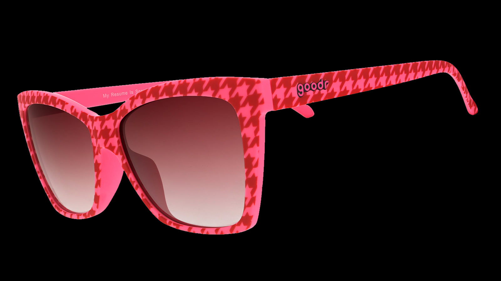 Three-quarter angle view of pink and red houndstooth Pop Gs with rose gradient lenses.