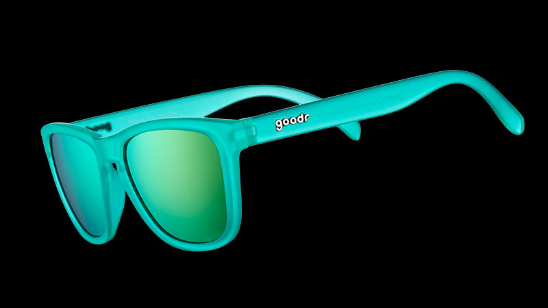 Three-quarter angle view of square-shaped teal sunglasses with teal reflective polarized lenses.