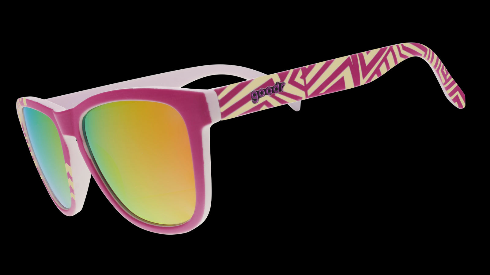 Three-quarter view of a pair of sunglasses with a purple faceplate, pink reflective lenses, and geometric striped purple and yellow design.