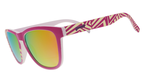 Three-quarter view of a pair of sunglasses with a purple faceplate, pink reflective lenses, and geometric striped purple and yellow design.
