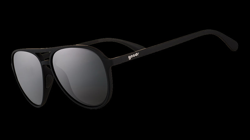 Three-quarter angle view of black aviator sunglasses with black non-reflective lenses.