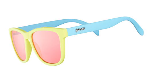 Three-quarter angle view of pastel blue and yellow sunglasses with square-shaped rose-tinted lenses.