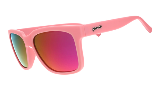 Three-quarter angle view of pink sunglasses with pink-purple lenses designed to float in water.