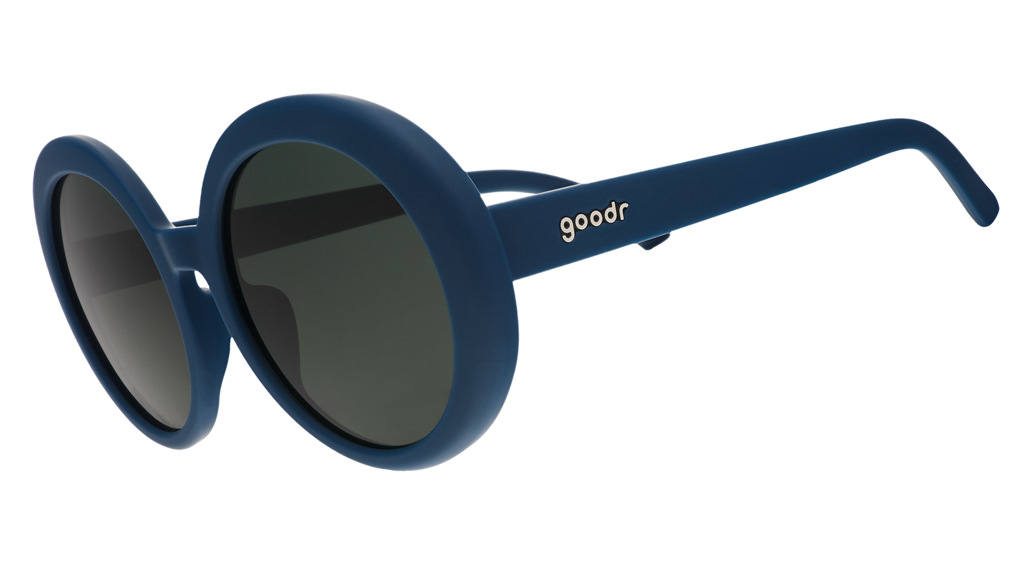 Three-quarter view of a pair of oversized, round sunglasses in a deep green with green non-reflective lenses.