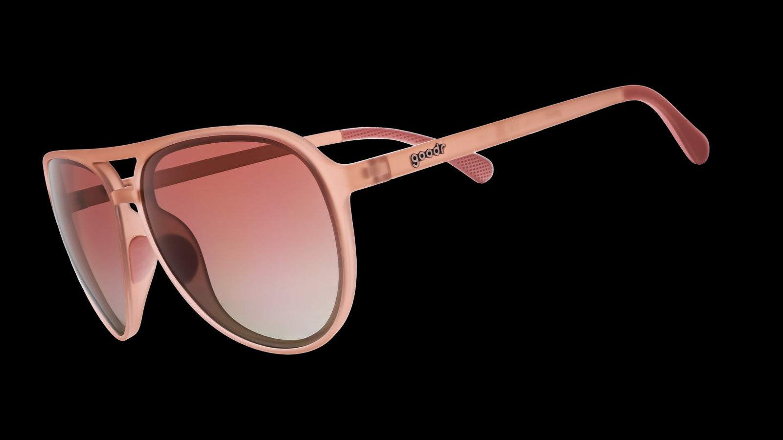 Three-quarter angle view of translucent pink aviator sunglasses with rose gradient lenses.