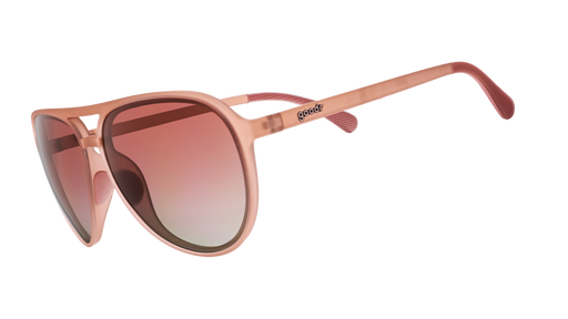 Three-quarter angle view of translucent pink aviator sunglasses with rose gradient lenses.