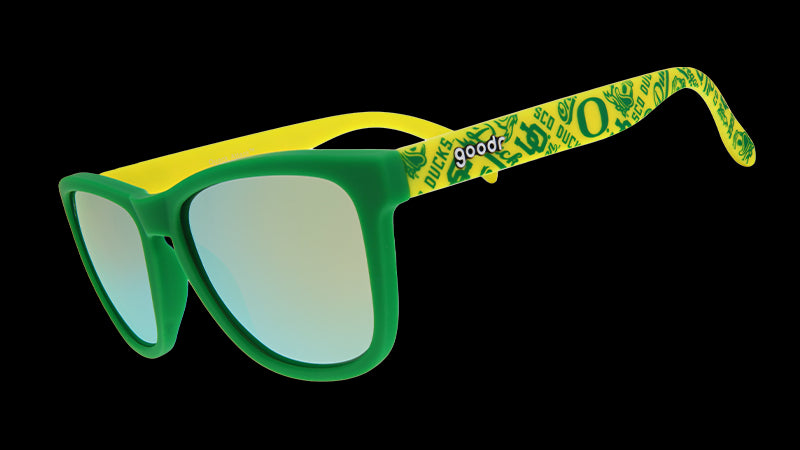 Green and yellow sunglasses with mirrored lenses, featuring a pattern of Oregon Ducks symbols and logos on the arms.