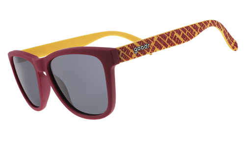 Three-quarter angle view of dark red and yellow sunglasses with an ASU print and black lenses.
