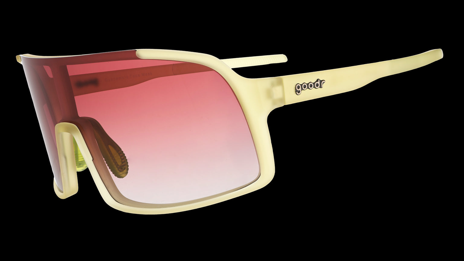 Three-quarter angle view of chartreuse wrap sunglasses with a rose gradient shield lens.