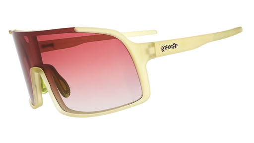 Three-quarter angle view of chartreuse wrap sunglasses with a rose gradient shield lens.