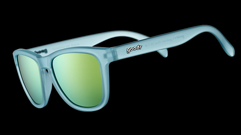 Three-quarter angle view of square-shaped sunglasses with light blue translucent frames and gold reflective lenses.
