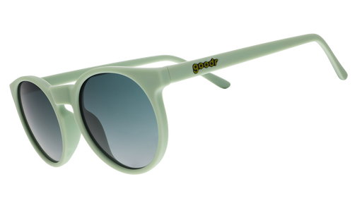A pair of round sunglasses with mint green frames.