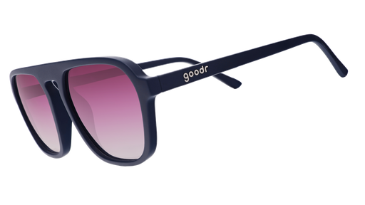 A pair of dark blue goodr sunglasses with gradient pink lenses, on a white background.