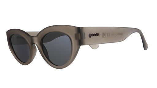 Three-quarter angle view of translucent dark gray, retro-inspired angled cat-eye sunglasses with black non-reflective lenses.
