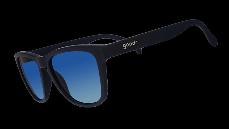 Sunglasses with a sleek navy frame and blue gradient lenses. The arms are solid black, featuring the goodr logo in white near the hinge.