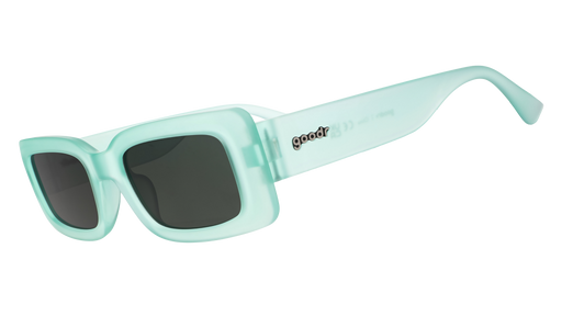 Three-quarter angle view of translucent light green rectangular sunglasses with green lenses.
