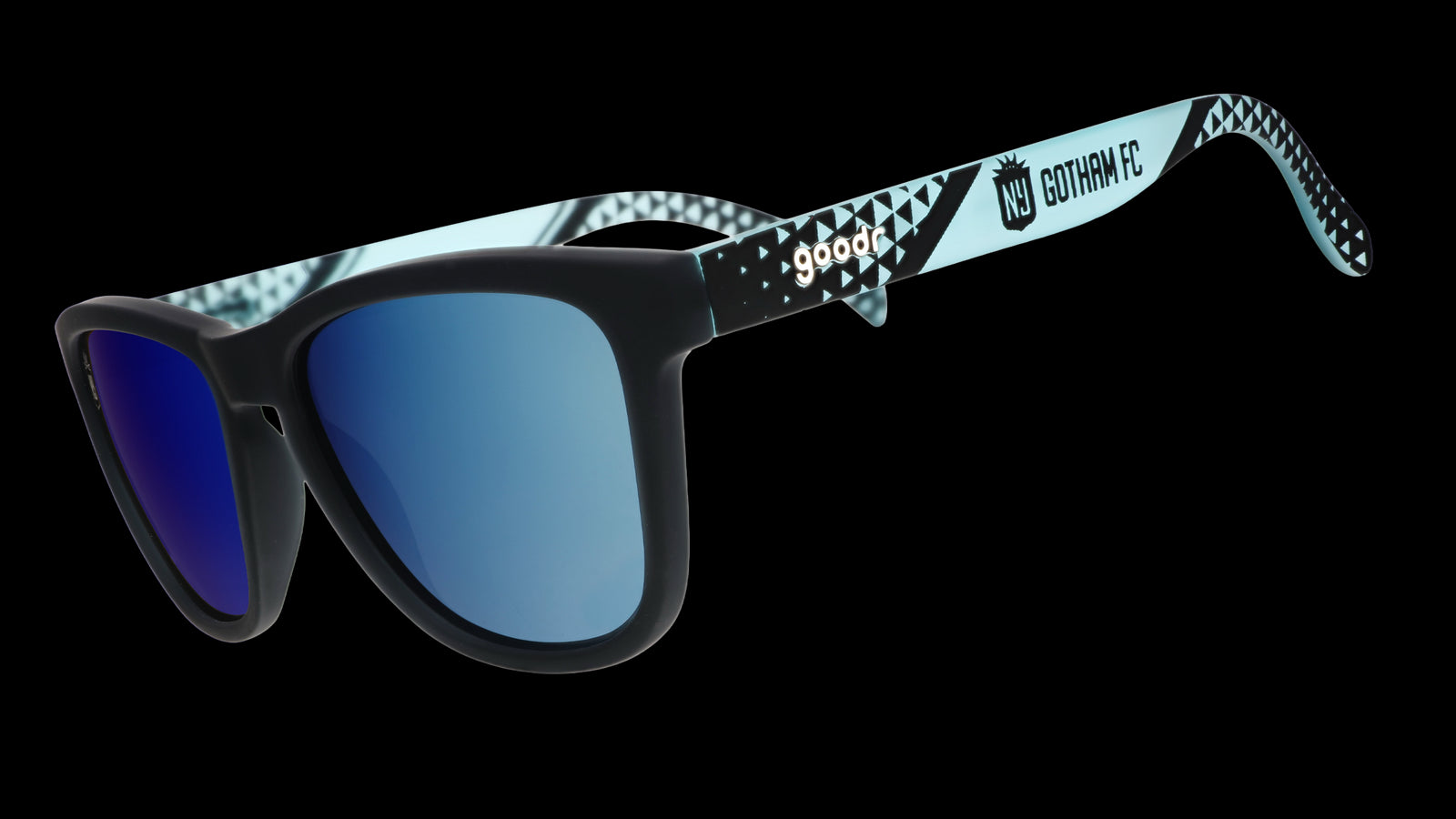 Sunglasses with blue lenses and patterned black and white frame on a white background