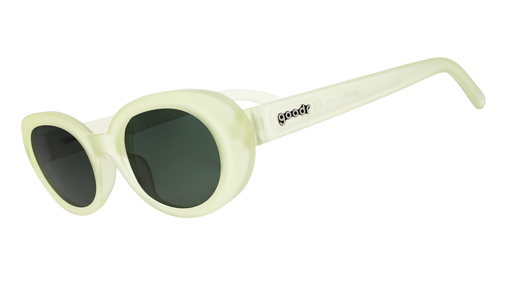 Three-quarter angle view of a pair of pale, citron-colored, oval-shaped sunglasses with black, non-reflective lenses.