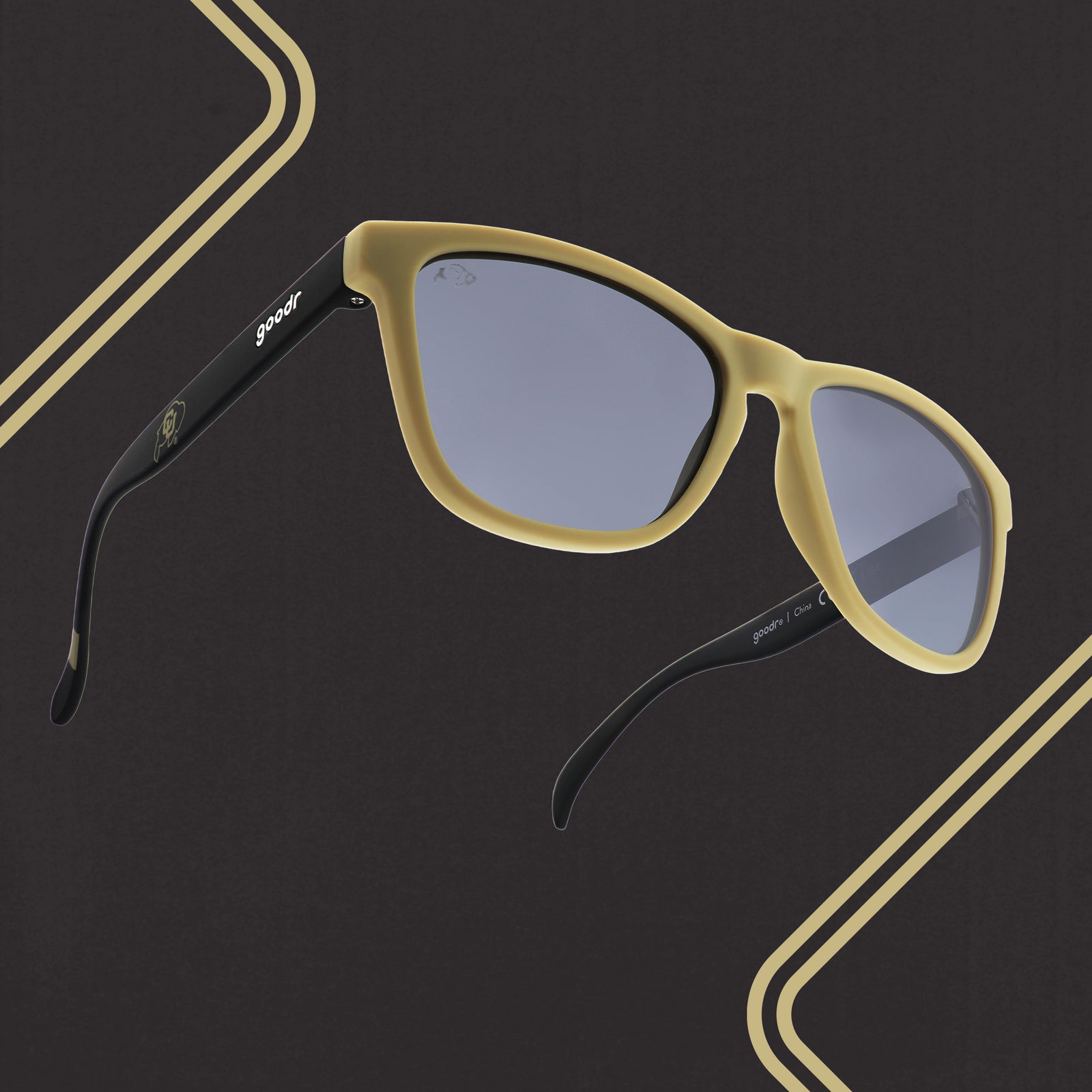 Three-quarter right angle view of light brown and brown sunglasses with a Colorado print and black lenses.