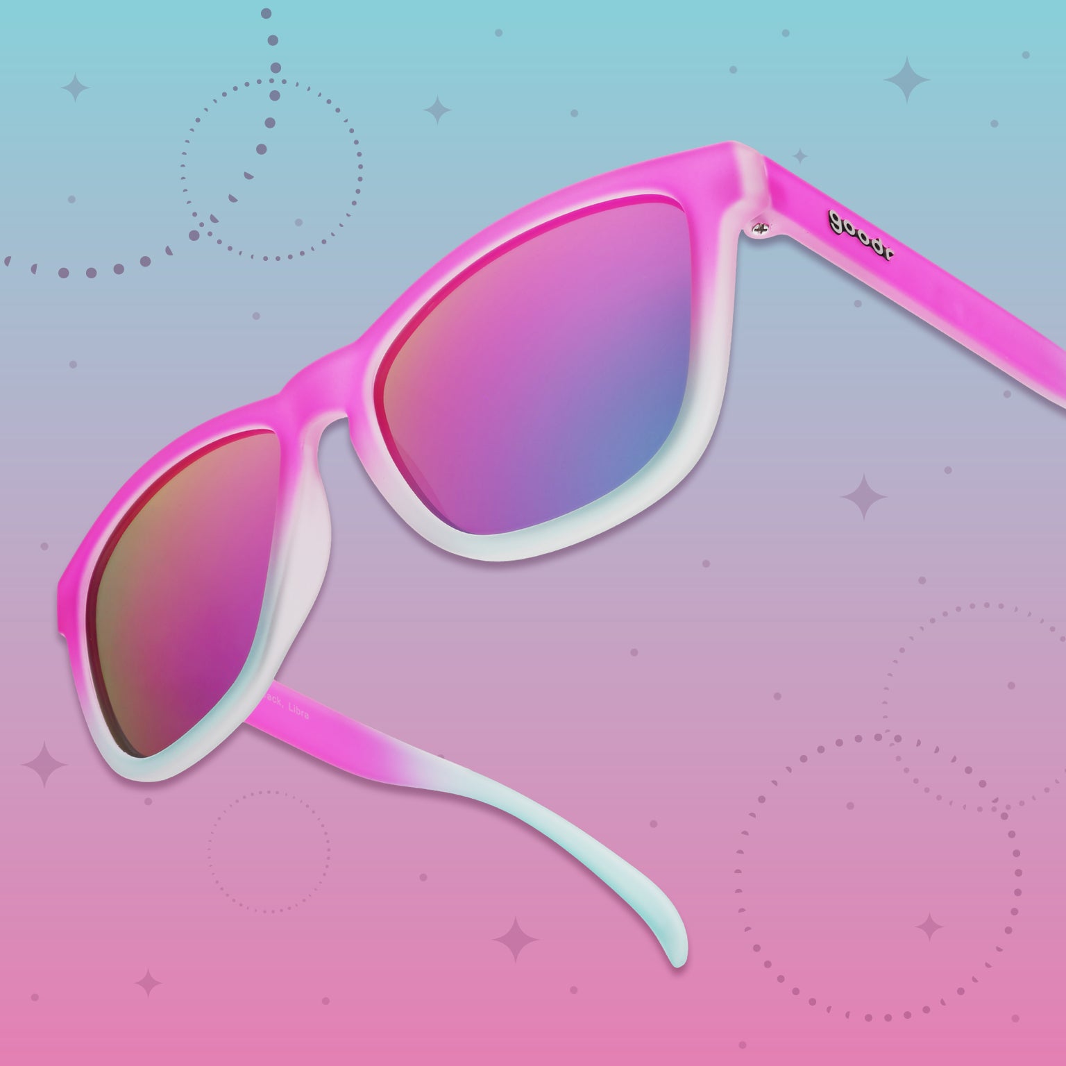 Side view of pink-to-light-blue goodr sunglasses with purple-pink lenses on a vibrant green graphic background.
