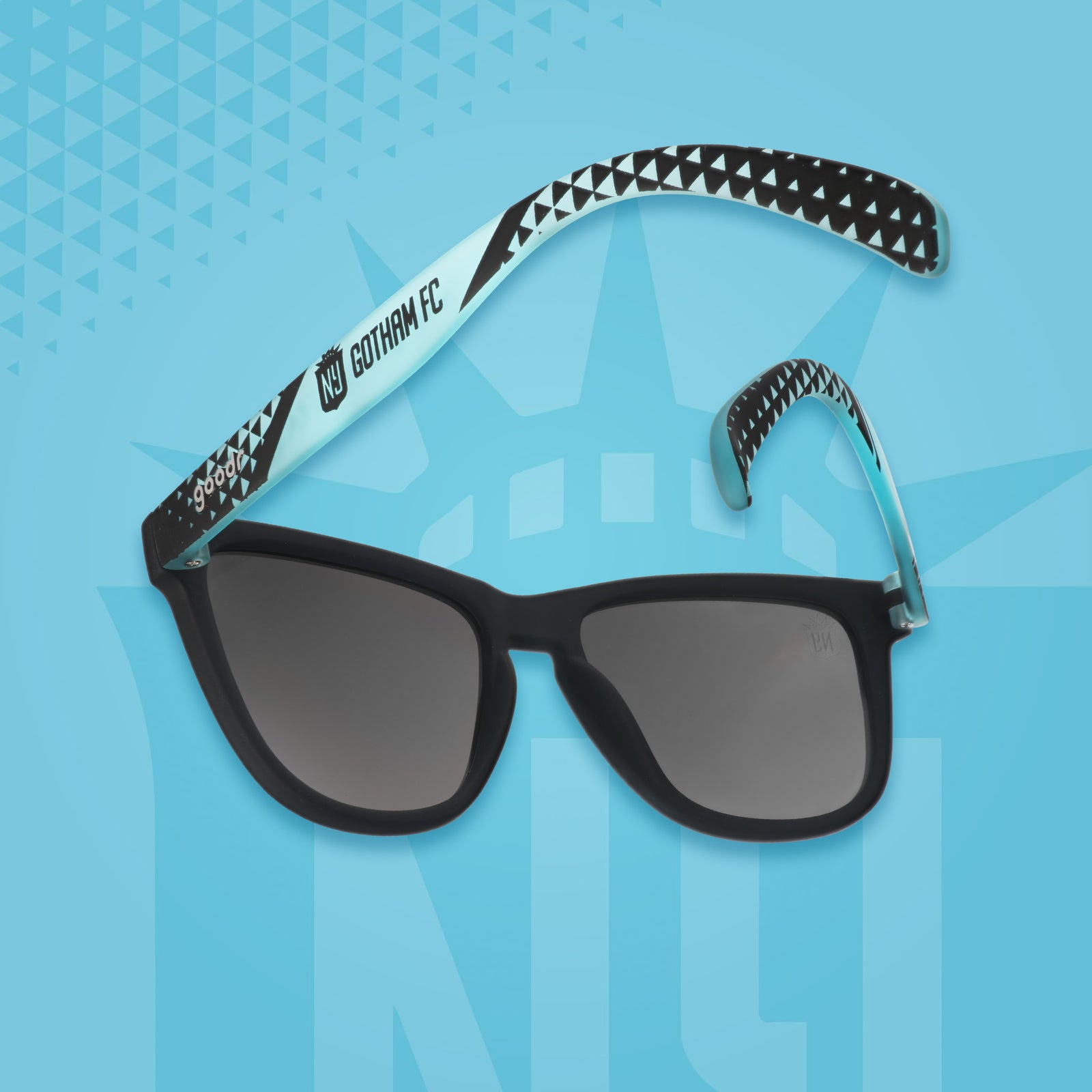 Black sunglasses with a blue pattern on a blue background