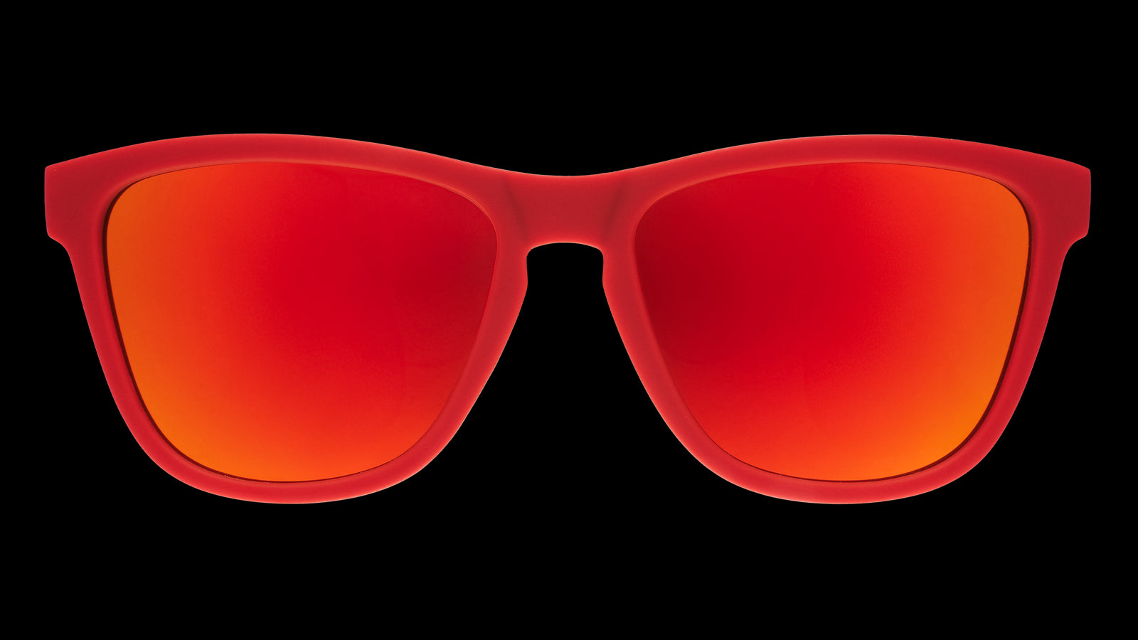 Front view of red Canada sunglasses with maple leaf-patterned frames and burnt orange reflective lenses.