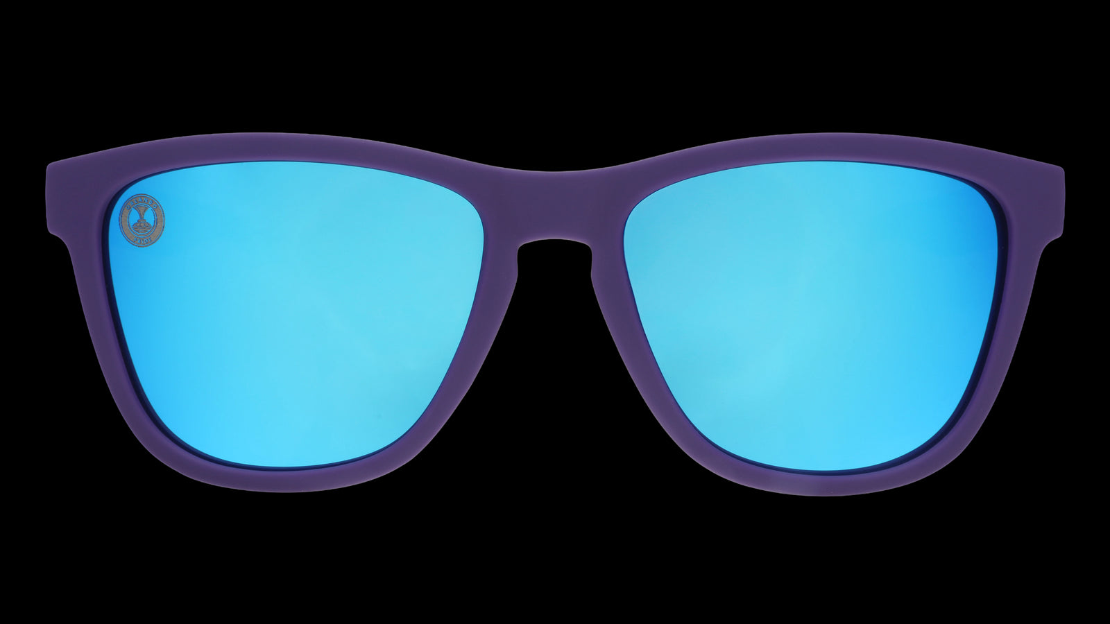 Sunglasses with blue lenses and purple frame on a white background