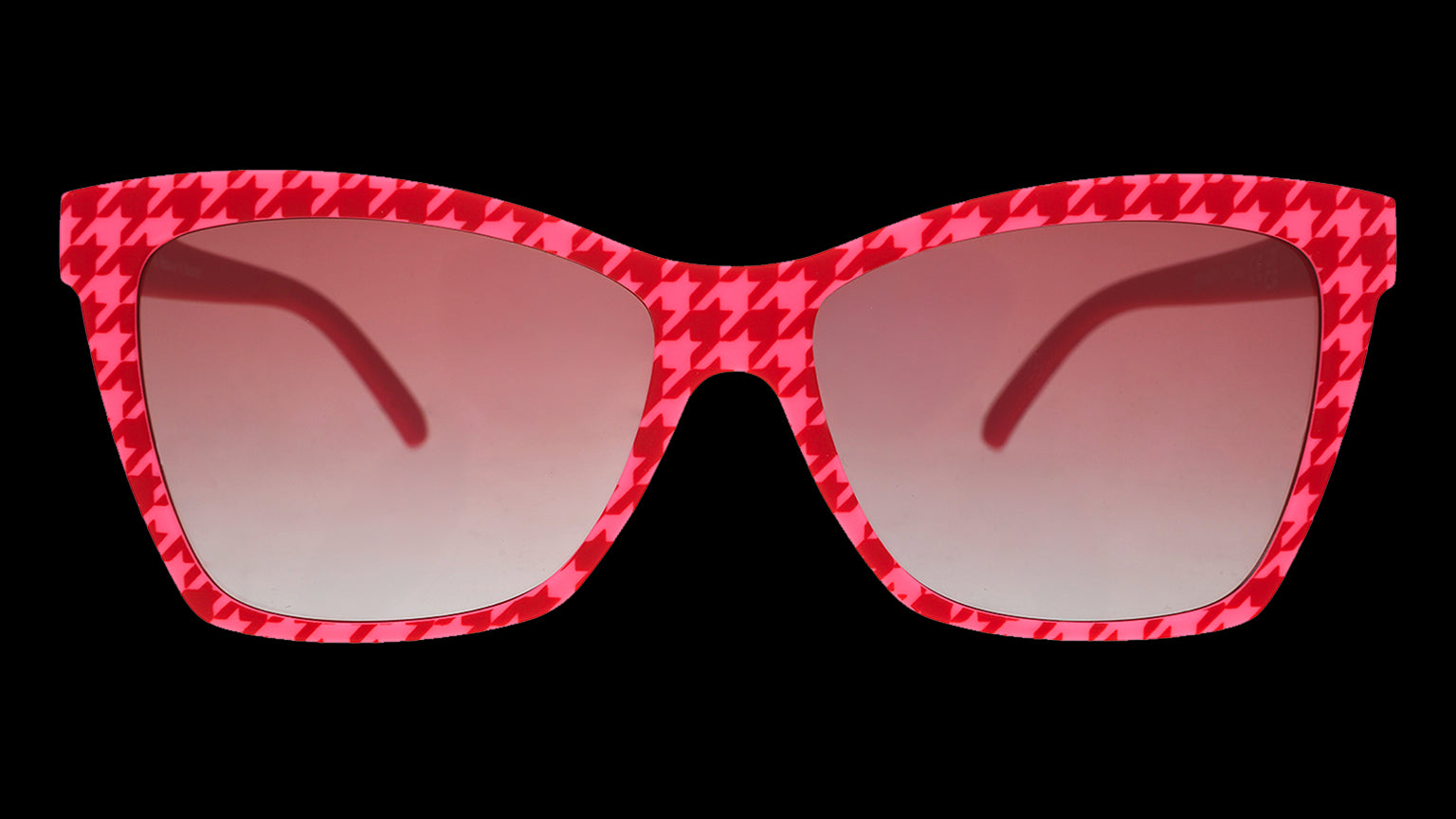 Front angle view of a pair of pink and red houndstooth Pop Gs with rose gradient lenses.