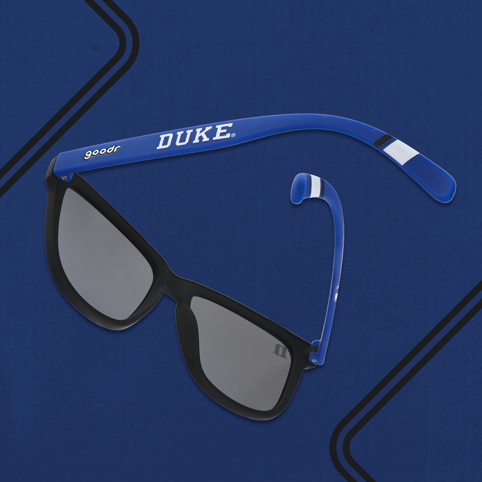 Three-quarter angle back view of blue & black Duke University® Blue Devils® shades with blue lenses on blue background.