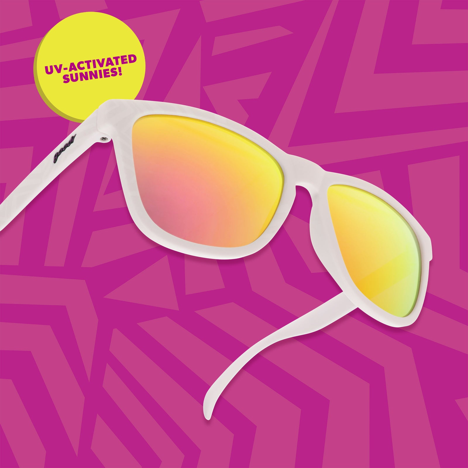 Three-quarter view of white sunglasses floating on a bright fuchsia background with a geometric design, a yellow badge indicates they are UV-activated.
