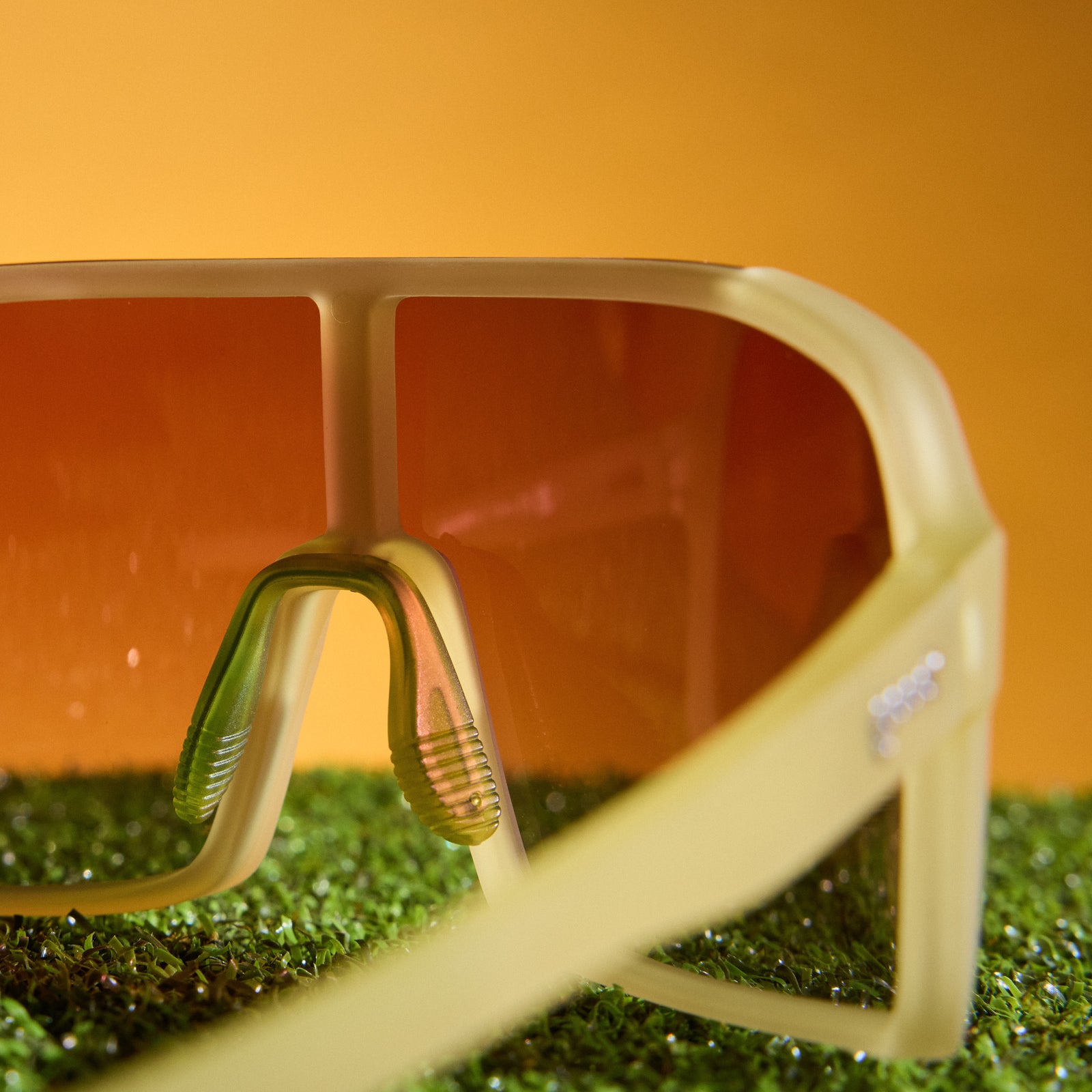 Back angle view of chartreuse wrap sunglasses with a rose gradient shield lens.