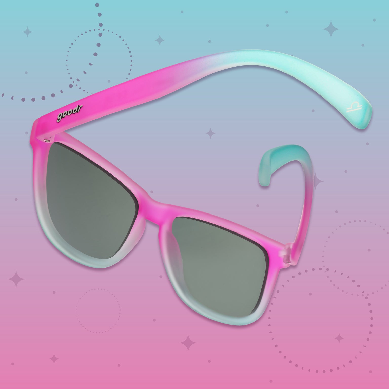 Back view of pink-to-light-blue gradient goodr sunglasses on a blue and pink graphic background.