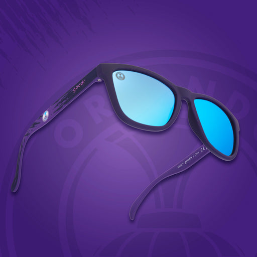Sunglasses with blue lenses on a purple background