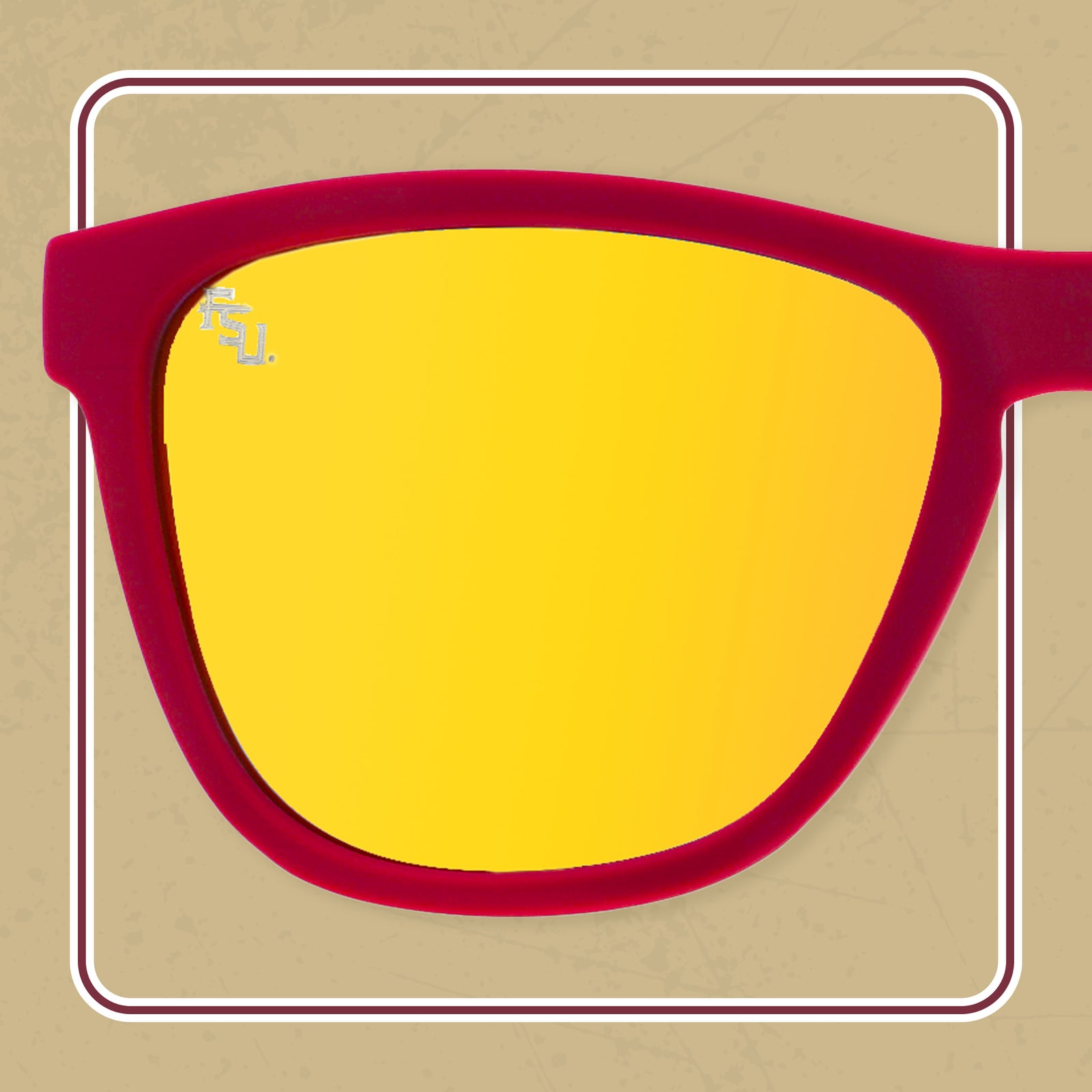 A pair of sunglasses with red frames and reflective yellow lenses. The lenses feature a small "FSU" logo in the upper left corner, representing Florida State University.