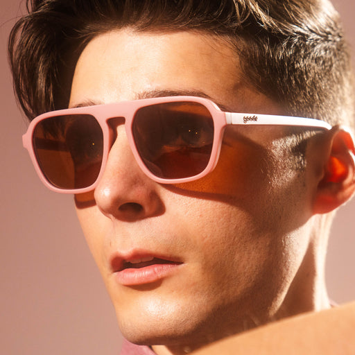Man wearing pink retro aviator sunglasses.